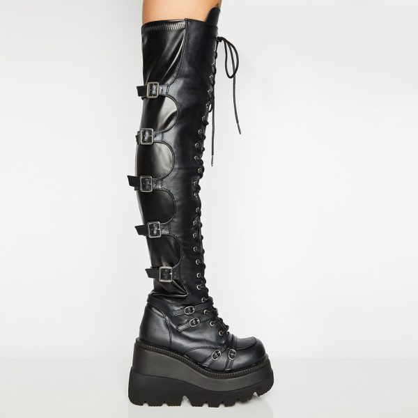 Over-the-knee boots with a raised platform