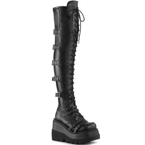 Over-the-knee boots with a raised platform