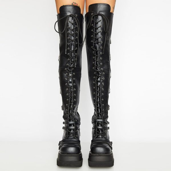 Over-the-knee boots with a raised platform