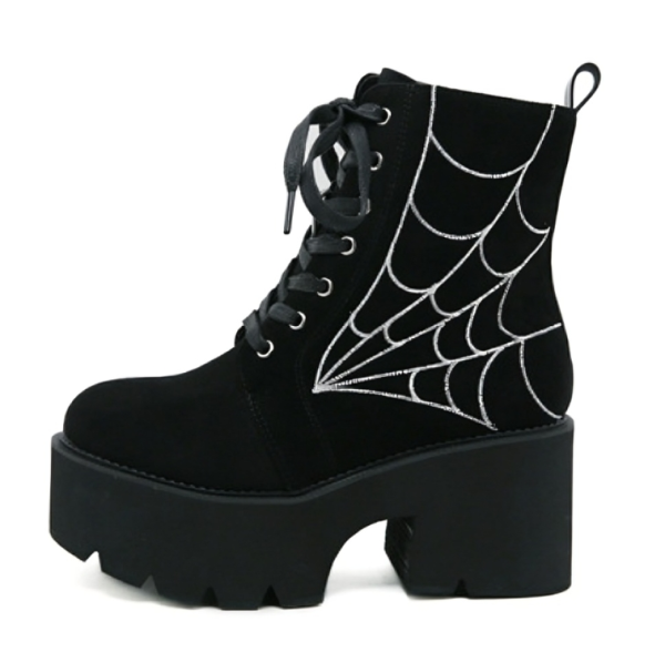 Ankle suede boots with a spider web design on the side